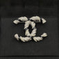 18K  Chanel Black & White Gold Diamond Brooch